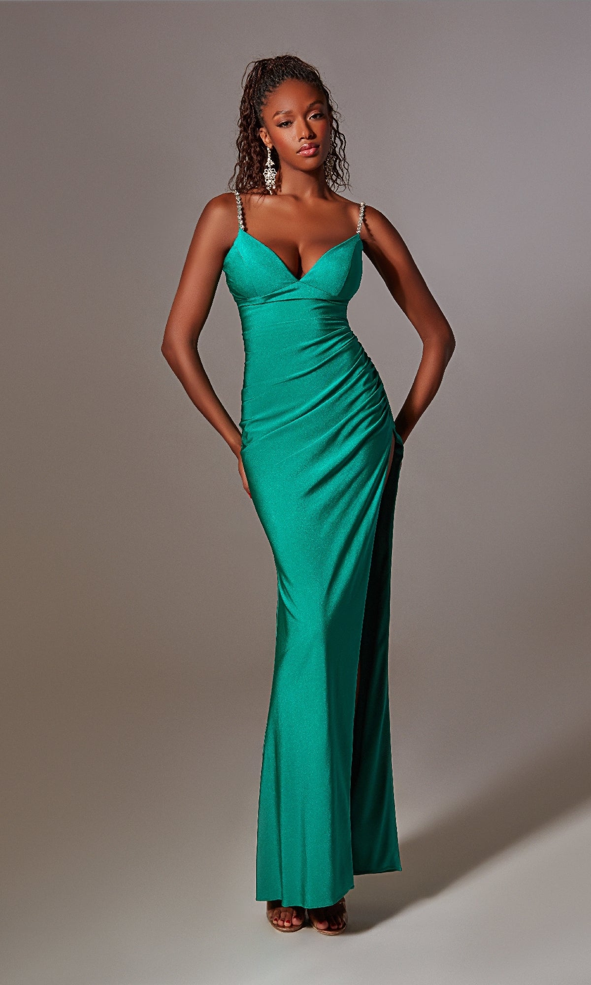 A woman in the Beaded-Straps Long Prom Dress: Aerie Couture 231, a stunning green evening gown.